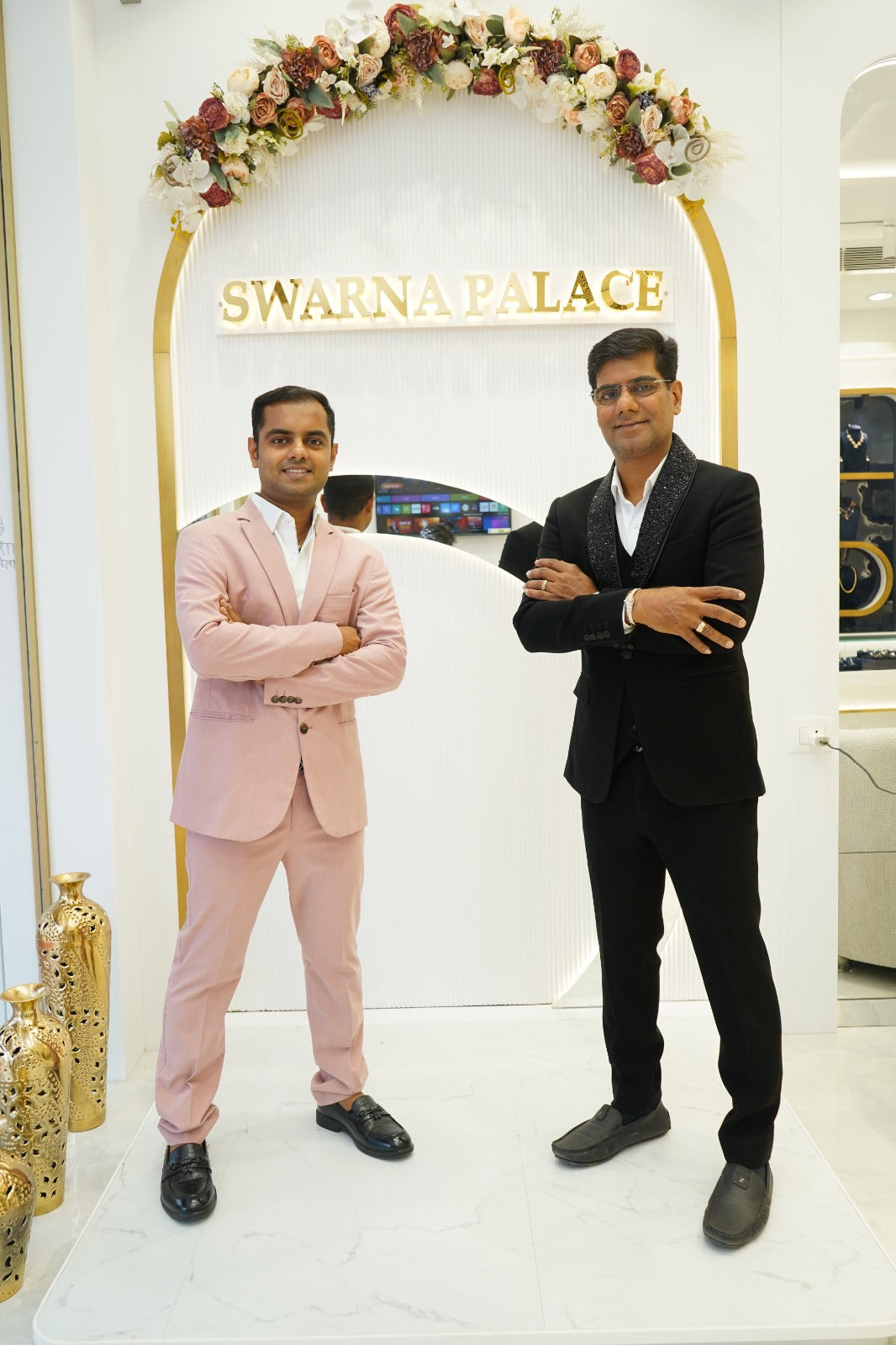 Pravin Jain and Ronak Jain standing inside the Swarna Palace store